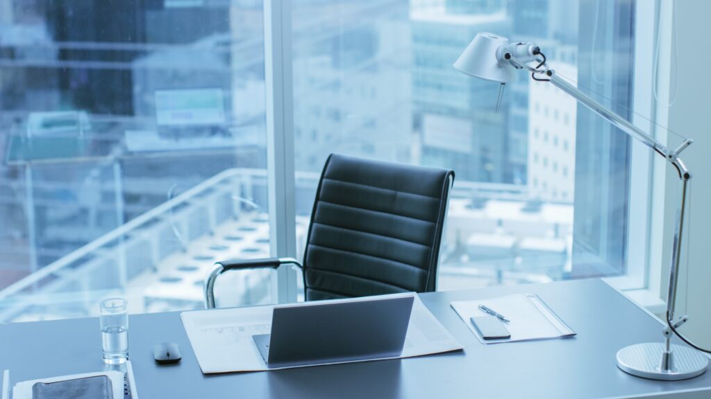 Empty office chair by a window